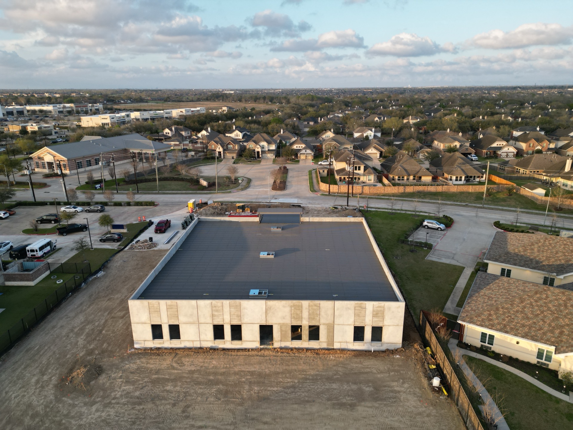 Aerial still of the CLS Clinic site, March 2026 — view 1 of 4