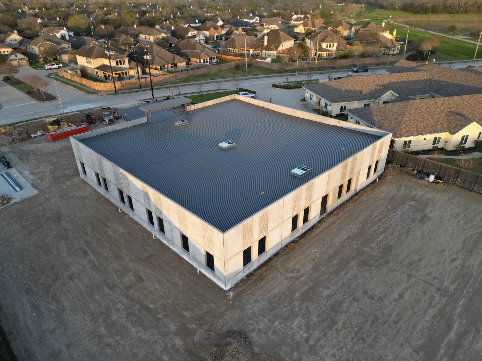 Aerial still of the CLS Clinic site, March 2026 — view 2 of 4